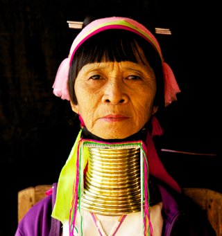 A woman with rings around her neck in order to elongate it