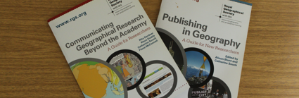 Two booklets on top of a wooden surface. The text on one booklet reads 'Communicating Geographical Research Beyond the Academy' and the other reads 'Publishing in Geography'.