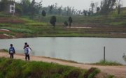 Three school children in a rural area of China.