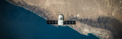 A space satellite above a coastline