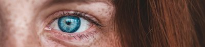 Person with a blue eye close up
