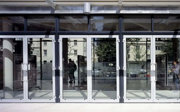 Three sets of glass double doors showing the inside of the pavilion.