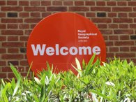 Orange welcome sign that reads Royal Geographical Society with IBG.