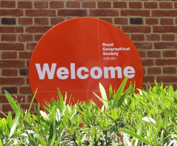 Orange welcome sign that reads Royal Geographical Society with IBG.