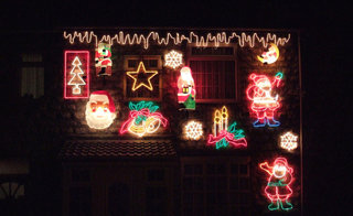 Christmas lights on a house at night