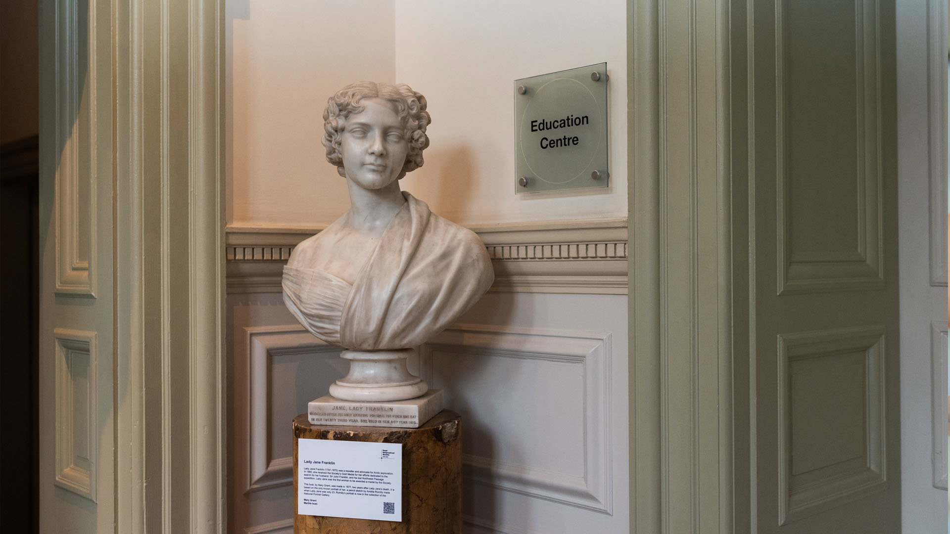 White marble bust of Lady Jane Franklin on a pedastal.