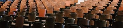 Empty wooden lecture theatre seats