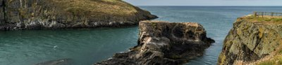 Cardigan Bay landscape along the coastal walk showing a rocky cliff