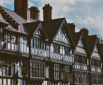 Black and white tudor style buildings on a street