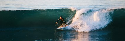 Man surfing on an ocean wave