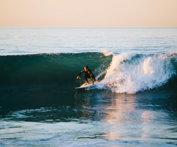 Man surfing on an ocean wave
