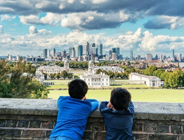 Two people looking out over the view of Greenwich and London