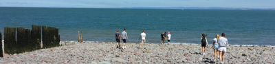 Pupils from 2022 Frederick Soddy Schools Award recipient Blenheim High School undertaking fieldwork on a beach to investigate the impact of coastal processes in Porlock Bay, Somerset