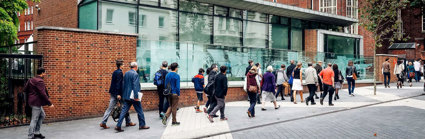 Outside view of the RGS' building with people passing by the RGS pavilion on Exhibition Road.