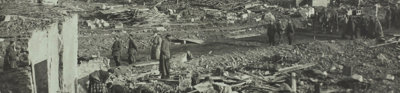 Damaged French city of Lille, during German Occupation, World War I, 1916. People stand scattered amongst debris. Almost all buildings are entirely destroyed.