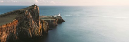 Brown cliffs with lighthouse