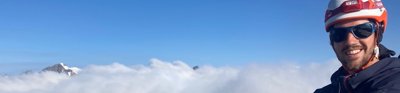 Felix de Montety above the clouds atop a mountain