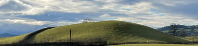 View of a drumlin, a mound-shaped hill.