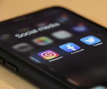 Smartphone showing Facebook, Instagram and Twitter apps 