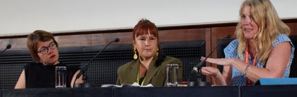 Three women on a conference panel