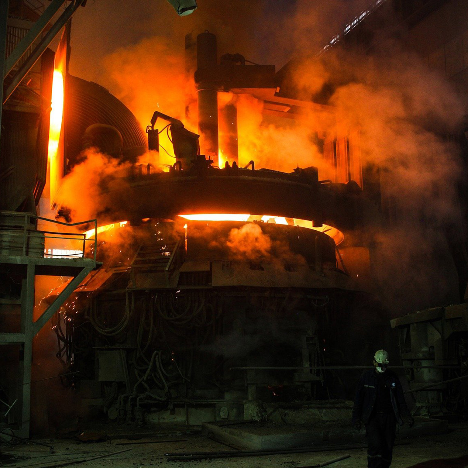 A blast furnace glowing orange with the extreme heat it is producing 