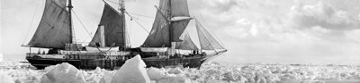 Photograph in black and white showing the sideview of the Endurance sailing ship manouvering through ice floes in the Arctics.