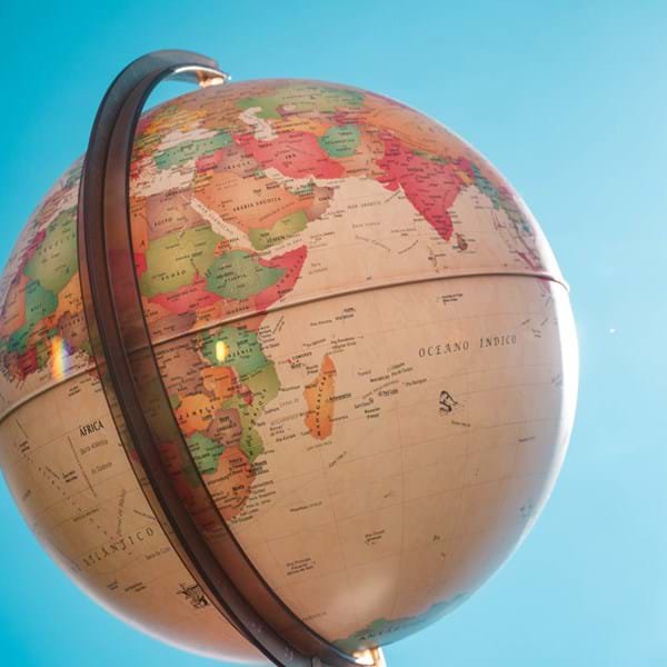 A white and red globe under a blue sky