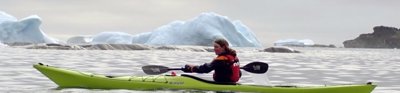 Katherine Durkin in a kayak paddling through the fjords