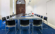 A meeting room setup in boardroom style.