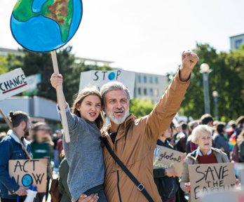 People with placards and posters about climate change