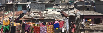 A settlement with colourful washing hanging up