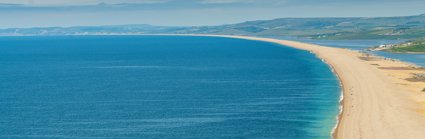 A long shingle barrier beach viewed from height