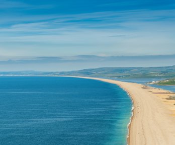 A long shingle barrier beach viewed from height