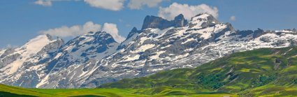 Mountains and green hills with houses