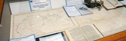 Display of historic materials including maps and books