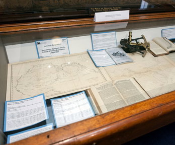 Display of historic materials including maps and books