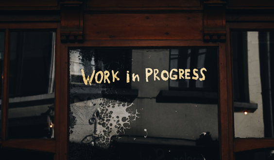 A dark window with the words 'Work in progress' written across it