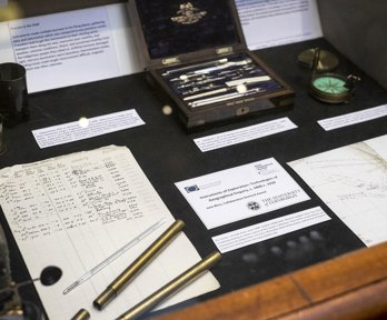 Display of historic materials, including archival papers and scientific instruments