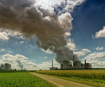 Smoking factory during daytime