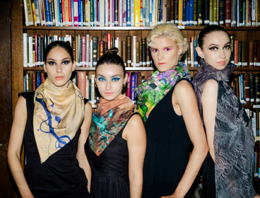 Four models wearing brightly-coloured scarves from the Tammam and European Space Agency collection.