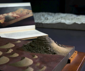 A plaster and wooden model showing a sand dune formation.