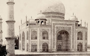 Old black and white photograph of the Taj Mahal in Agra’s facade.