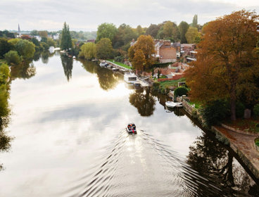 Boat on the canal in Chester seen from above.