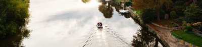 Boat on the canal in Chester seen from above.