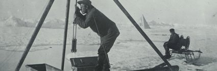 A man using scientific equipment in a polar environment