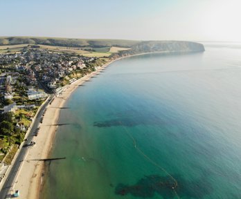 A bay from above showing groynes and a sandy beach